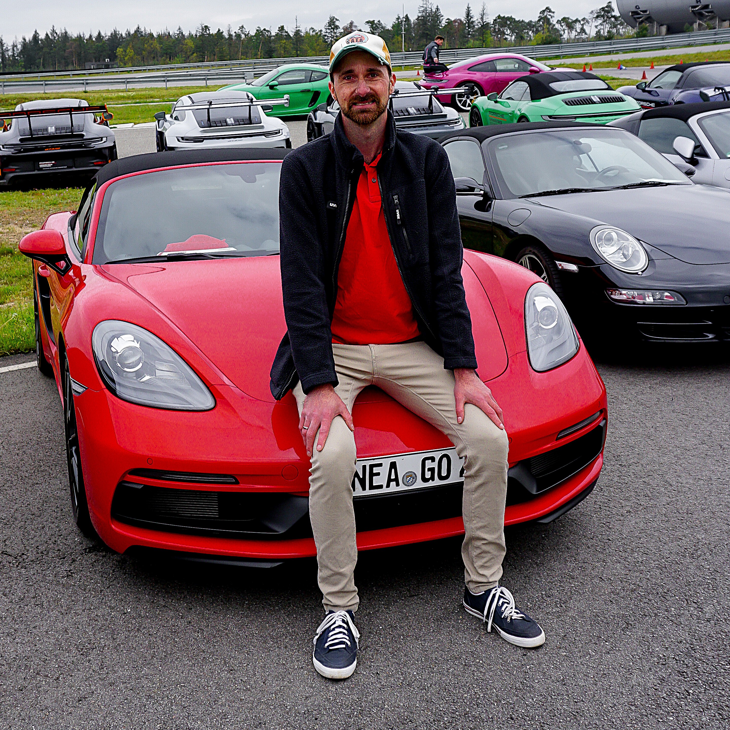 Sebastian Goldberg with a red Porsche at a track event
